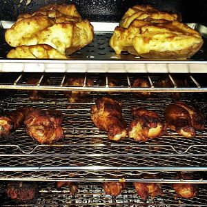 Smoked Wings V 3- wings & potatoes in the smoker.j