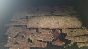 jerky & Sausage roll on smoker.jpg
