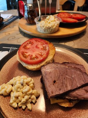 Roast beef sandwich with tomato and cheese and macaroni salad on side.jpg