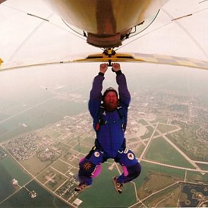 hanging from bi-plane.JPG