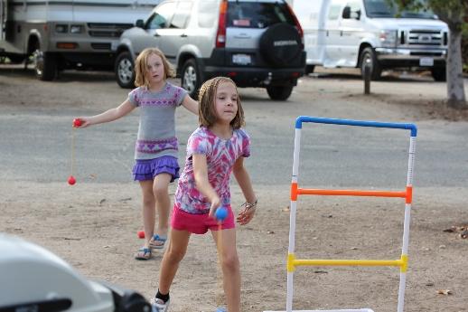 Aarons girls playing ladder ball.JPG