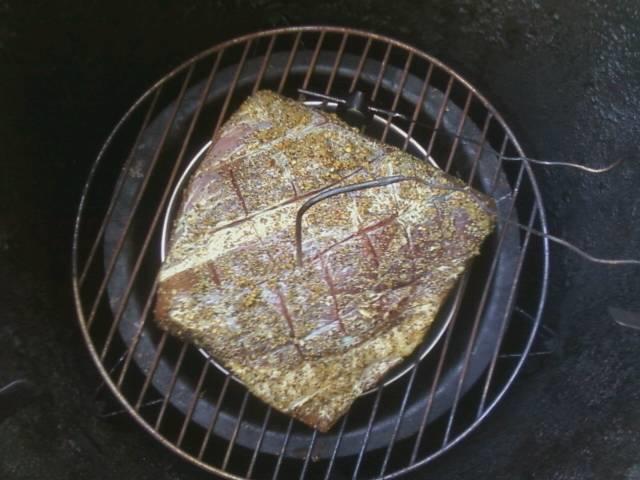 brisket seasoned and in.jpg