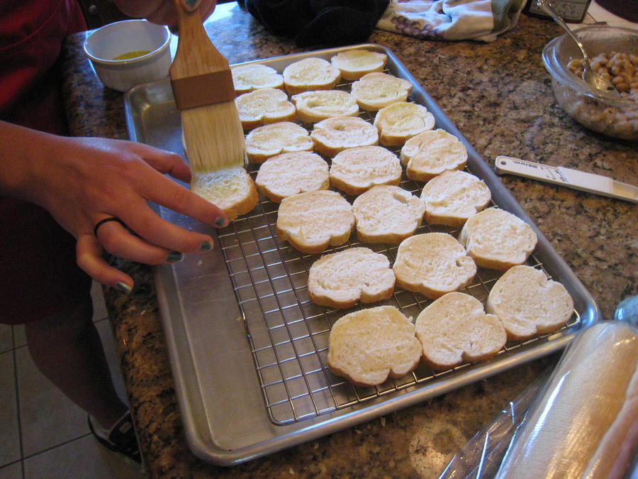 Brushing the crostini with olive oil.jpg