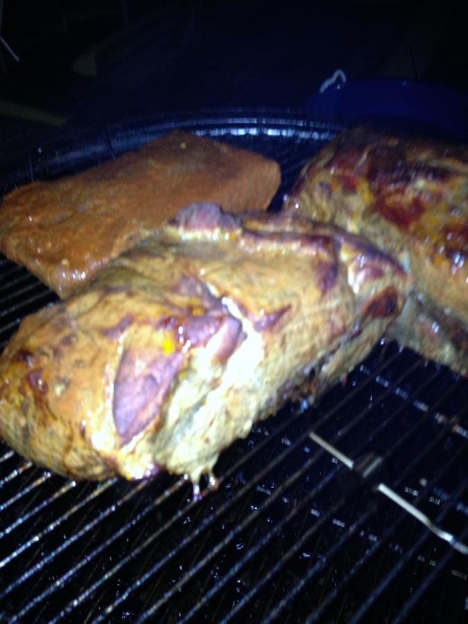 Butts and brisket in the smoke2.JPG