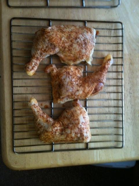 chicken quarters with rub and ready for smoker.jpg