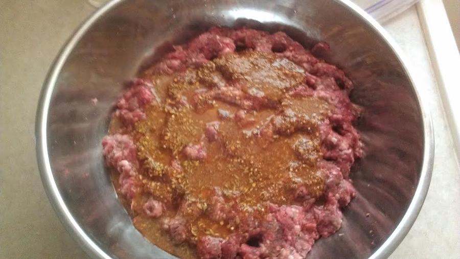 into 5# of venison.pork mixture.jpg