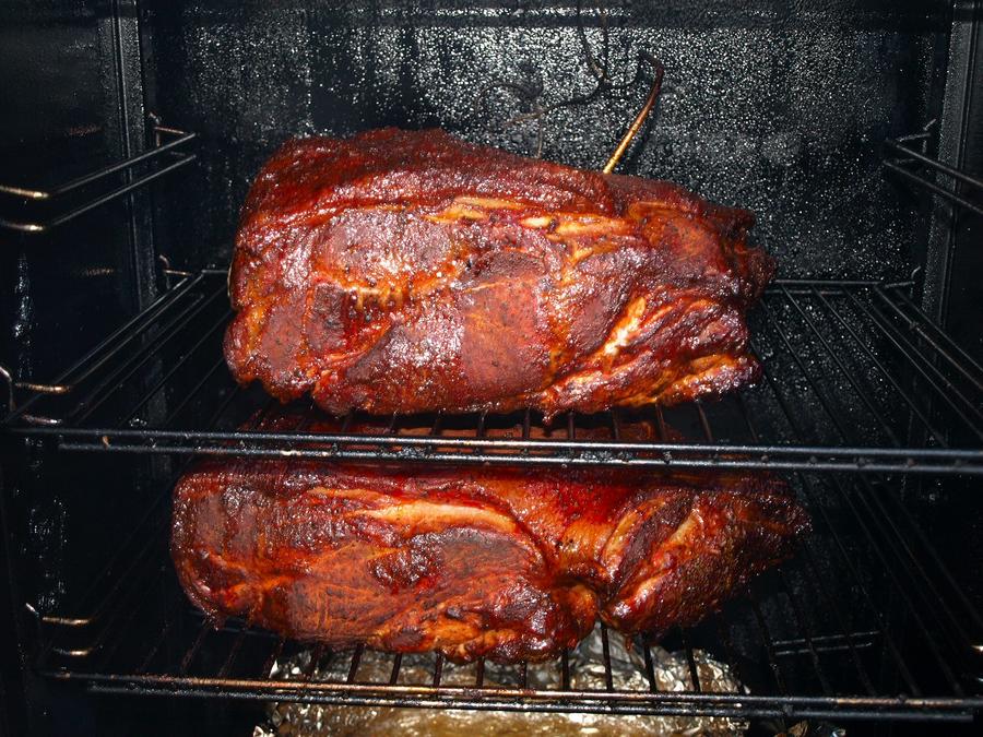 Pork butts over three hours in smoker 7-2-2010.jpg