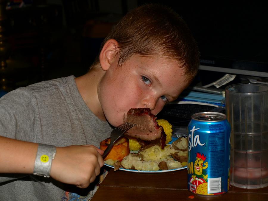 William enjoys his brisket 8-20-2011.jpg